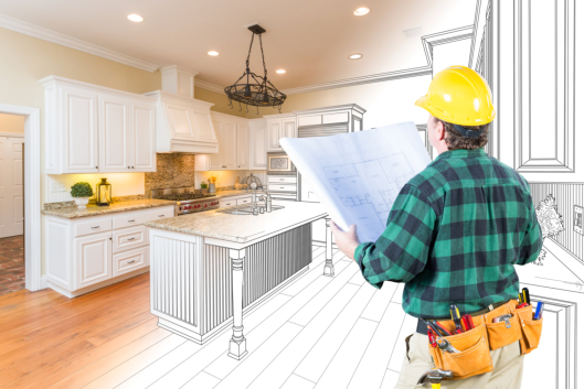 man looking the blueprint for the kitchen design